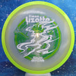 Load image into Gallery viewer, Top-down view of an Axiom Aspect fairway driver disc golf disc in Eclipse Glow plastic with a lime green overmold rim and a white, green, and lime foil Simon Lizotte Halloween Tour Series stamp.
