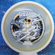 Load image into Gallery viewer, Top-down view of an Axiom Aspect fairway driver disc golf disc in Eclipse Glow plastic with a white overmold rim and a black, white, and gold holographic foil Simon Lizotte Halloween Tour Series stamp.
