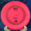 Load image into Gallery viewer, Top-down view of a pink Axiom Proxy putt and approach disc golf disc in Electron Firm plastic featuring a red GYRO overmold rim and black foil stock Proxy stamp.
