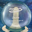 Load image into Gallery viewer, Innova Champion Leopard disc golf disc on a blue background
