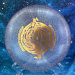 Load image into Gallery viewer, Top-down view of a brand-new light purple sparkle DGA Aftershock midrange disc golf disc in SP Line plastic with a gold foil Gravity Black Hole custom stamp.
