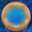 Load image into Gallery viewer, Top-down view of an orange sparkle DGA Rift midrange disc golf disc in SP Line plastic featuring an aqua holographic foil Black Hole special edition stamp.
