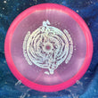 Load image into Gallery viewer, Top-down view of a pink sparkle DGA Rift midrange disc golf disc in SP Line plastic featuring a silver stars foil Black Hole special edition stamp.
