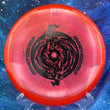Load image into Gallery viewer, Top-down view of a red sparkle DGA Rift midrange disc golf disc in SP Line plastic featuring a black foil Black Hole special edition stamp.

