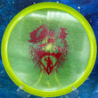 Load image into Gallery viewer, Top-down view of a neon yellow metal flake Discmania MD3 midrange disc golf disc in Metal Flake C-Line plastic featuring a red foil Unearthed special edition stamp.
