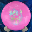 Load image into Gallery viewer, Top-down view of a brand-new pink Dynamic Discs Escape fairway driver disc golf disc in BioFuzion plastic with a gold holographic foil custom Unearthed stamp.
