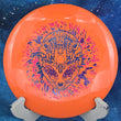 Load image into Gallery viewer, Orange I-Blend Centurion disc golf driver, 173g, with a pink, purple, and blue Special Edition 3-foil Alien Head stamp.
