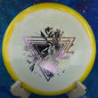 Load image into Gallery viewer, Top-down view of a yellow and white Innova Boss distance driver disc golf disc in Halo Star plastic with a pink and silver two-foil Special Edition Neon Astro stamp.
