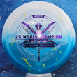 Load image into Gallery viewer, Top-down view of an Innova Destroyer Eveliina Salonen Commemorative distance driver disc golf disc in white and blue Party Time Duo plastic with a silver and purple holographic foil stamp scaled at 173g.
