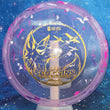 Load image into Gallery viewer, Top-down view of an Innova Fox Ohn Scoggins Commemorative Party Time midrange disc golf disc in pink and white Proto Glow Champion Halo plastic with a gold holographic foil stamp scaled at 180g.
