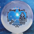 Load image into Gallery viewer, Top-down view of an Innova Teebird Rainers Balodis Commemorative fairway driver in burple and white Duo Star plastic with black and blue holo foil stamp scaled at 174g.
