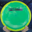 Load image into Gallery viewer, Top-down view of a yellow and lime green Innova Tern distance driver disc golf disc in Halo Star plastic featuring a purple foil Factory Second F2 stamp.
