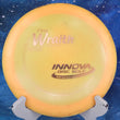 Load image into Gallery viewer, Pre-owned Innova Wraith in orange Pro plastic. This vintage "penned" variant is rated 7/10 for condition with ink on the back and a scaled weight of 176g. A classic understable distance driver for experienced players.
