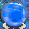 Load image into Gallery viewer, Top-down view of a brand-new dark blue MVP Energy distance driver disc golf disc in Neutron plastic with a black GYRO overmold rim and black foil stock Energy logo stamp.
