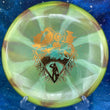 Load image into Gallery viewer, Top-down view of a lime and orange swirl Mint Discs Mustang midrange disc golf disc in Sublime Swirl plastic featuring a gold foil Unearthed special edition stamp.
