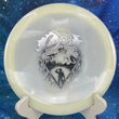 Load image into Gallery viewer, Top-down view of a glow Mint Discs Phoenix fairway driver disc golf disc in Nocturnal Glow plastic featuring a silver foil Unearthed special edition stamp.
