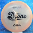 Load image into Gallery viewer, Top-down view of a pre-owned peach 2022 Ledgestone limited edition Discraft Drone very overstable midrange disc golf disc in Z Swirl plastic scaled at 180g in 7 out of 10 uninked condition.
