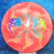 Load image into Gallery viewer, Top-down view of a pre-owned red and yellow swirl Discraft Luna putt and approach disc golf disc in Battle Pack Z Swirl plastic scaled at 175g in 8 out of 10 uninked condition.

