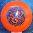 Load image into Gallery viewer, Top-down view of a pre-owned neon orange Dynamic Discs Felon 2020 Glass Blown Open tournament edition fairway driver disc golf disc in Lucid Metal Flake plastic scaled at 170g in brand new 10 out of 10 uninked condition.
