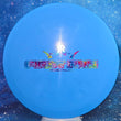 Load image into Gallery viewer, Top-down view of a pre-owned blue Dynamic Discs Felon First Run featuring a party time foil stamp in Prime plastic scaled at 170g in 9.5 out of 10 uninked condition with minor storage wear.

