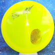 Load image into Gallery viewer, Top-down view of a pre-owned neon yellow Paige Pierce signed Dynamic Discs Felon fairway driver disc golf disc in Lucid Metal Flake plastic scaled at 174g in brand new 10 out of 10 uninked condition.
