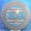 Load image into Gallery viewer, Top-down view of a pre-owned grey Dynamic Discs Felon Special Edition featuring a blue shatter stamp in Prime plastic scaled at 172g in brand new 10 out of 10 uninked condition.
