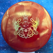 Load image into Gallery viewer, Top-down view of a pre-owned red Truly Unique Trilogy Man edition Westside Discs Warship midrange disc golf disc in Tournament plastic scaled at 168g in brand new 10 out of 10 uninked condition.
