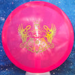 Load image into Gallery viewer, Top-down view of a pre-owned neon pink Truly Unique Trilogy Man edition Westside Discs Warship midrange disc golf disc in VIP plastic scaled at 169g in brand new 10 out of 10 uninked condition.
