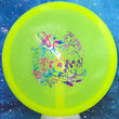 Load image into Gallery viewer, Top-down view of a pre-owned neon yellow Truly Unique Trilogy Man edition Westside Discs Warship midrange disc golf disc in VIP plastic scaled at 179g in brand new 10 out of 10 uninked condition.
