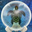Load image into Gallery viewer, Top-down view of a pre-owned 1 of 45 DyeMax Geometric Sea Turtle Westside Harp approach disc golf disc in VIP plastic scaled at 172g in brand new 10 out of 10 collector condition with certificate of authenticity.
