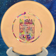 Load image into Gallery viewer, Top-down view of a pre-owned peach Kansas City Championship custom stamp Westside Harp approach disc golf disc in BT plastic scaled at 174g in 9.5 out of 10 uninked storage wear condition.
