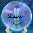 Load image into Gallery viewer, Top-down view of a pre-owned blue Ricky Wysocki tour series Westside Harp approach disc golf disc in VIP Glimmer plastic scaled at 174g in brand new 10 out of 10 uninked condition.
