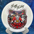 Load image into Gallery viewer, Top-down view of a pre-owned white Westside Harp approach disc golf disc featuring a festive holiday Trilogy Santa custom stamp.
