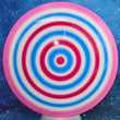 Load image into Gallery viewer, Top-down view of a pre-owned red, pink, and blue spin-dyed Axiom Discs Vanish understable distance driver disc golf disc in Neutron plastic scaled at 171g in 9.5 out of 10 uninked condition.

