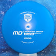 Load image into Gallery viewer, Top-down view of a pre-owned lightweight blue Discmania MD1 penned Innova-made run in D-Line baseline plastic scaled at 148g in brand new 10 out of 10 uninked condition.
