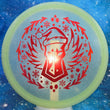 Load image into Gallery viewer, Top-down view of a pre-owned teal sparkle Discraft Buzzz Christmas Dark Horse edition midrange disc golf disc in Z FLX Sparkle plastic scaled at 179g in brand new 10 out of 10 uninked condition.
