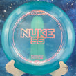 Load image into Gallery viewer, Blue Discraft Nuke disc with pink text on a blue background
