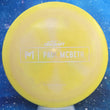 Load image into Gallery viewer, Top-down view of a yellow and pink swirl pre-owned Discraft Paul McBeth Prototype Malita midrange disc golf disc rated 7/10 condition.
