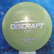 Load image into Gallery viewer, Top-down view of a pre-owned solid green Discraft Thrasher distance driver disc golf disc in ESP plastic featuring a custom money stamp scaled at 173g in 7 out of 10 inked condition.
