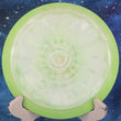 Load image into Gallery viewer, Top-down view of a pre-owned white and lime green swirl Discraft Thrasher Missy Gannon bottom stamp distance driver disc golf disc in ESP Swirl plastic scaled at 174g in 9 out of 10 inked condition.
