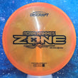 Load image into Gallery viewer, Top-down view of a pre-owned orange swirl Discraft Zone Adam Hammes tour series overstable approach disc golf disc in Z Swirl plastic scaled at 176g in 8 out of 10 inked condition.
