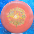 Load image into Gallery viewer, Top-down view of a pre-owned red glimmer swirly Discraft Zone approach disc golf disc in ESP Swirl plastic with a custom stamp and puddle top scaled at 174g in 9 out of 10 inked condition.

