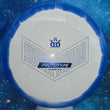 Load image into Gallery viewer, Top-down view of a pre-owned blue and white Dynamic Discs Felon Prototype Sockibomb edition fairway driver disc golf disc in Supreme Orbit plastic scaled at 176g in 9 out of 10 uninked condition.
