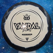 Load image into Gallery viewer, Top-down view of a pre-owned black and white Dynamic Discs Vandal 2023 Trilogy Challenge edition fairway driver disc golf disc in Fuzion Ice Orbit plastic scaled at 173g in 8 out of 10 inked condition.
