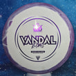 Load image into Gallery viewer, Top-down view of a pre-owned purple and white Dynamic Discs Vandal 2023 Trilogy Challenge edition fairway driver disc golf disc in Fuzion Ice Orbit plastic scaled at 174g in 8 out of 10 condition with ink on back.
