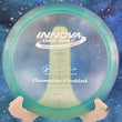 Load image into Gallery viewer, Pre-owned teal Innova Firebird Champion plastic distance driver, 173g, 12x Ken Climo signature edition with a silver foil stamp and inked in 7.5/10 condition.
