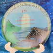 Load image into Gallery viewer, Top-down view of a pre-owned 2015 Full Color event edition Innova Roc midrange disc golf disc in penned Champion plastic scaled at 179g in 8.5 out of 10 condition with ink on back.
