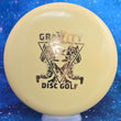 Load image into Gallery viewer, Top-down view of a pre-owned yellow Kastaplast Reko putt and approach disc golf disc in K1 plastic featuring a custom Gravity stamp scaled at 175g in brand new 10 out of 10 uninked condition.
