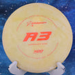 Load image into Gallery viewer, Top-down view of a pre-owned yellow Prodigy A3 approach disc golf disc in 400 plastic with a domey profile scaled at 174g in 8.5 out of 10 inked condition with a chalky texture.
