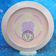 Load image into Gallery viewer, Top-down view of a pre-owned purple and yellow swirl Prodigy D1 Kevin Jones Team bottom stamped distance driver disc golf disc in 400 Spectrum plastic signed by Kevin Jones scaled at 175g in brand new 10 out of 10 uninked condition.
